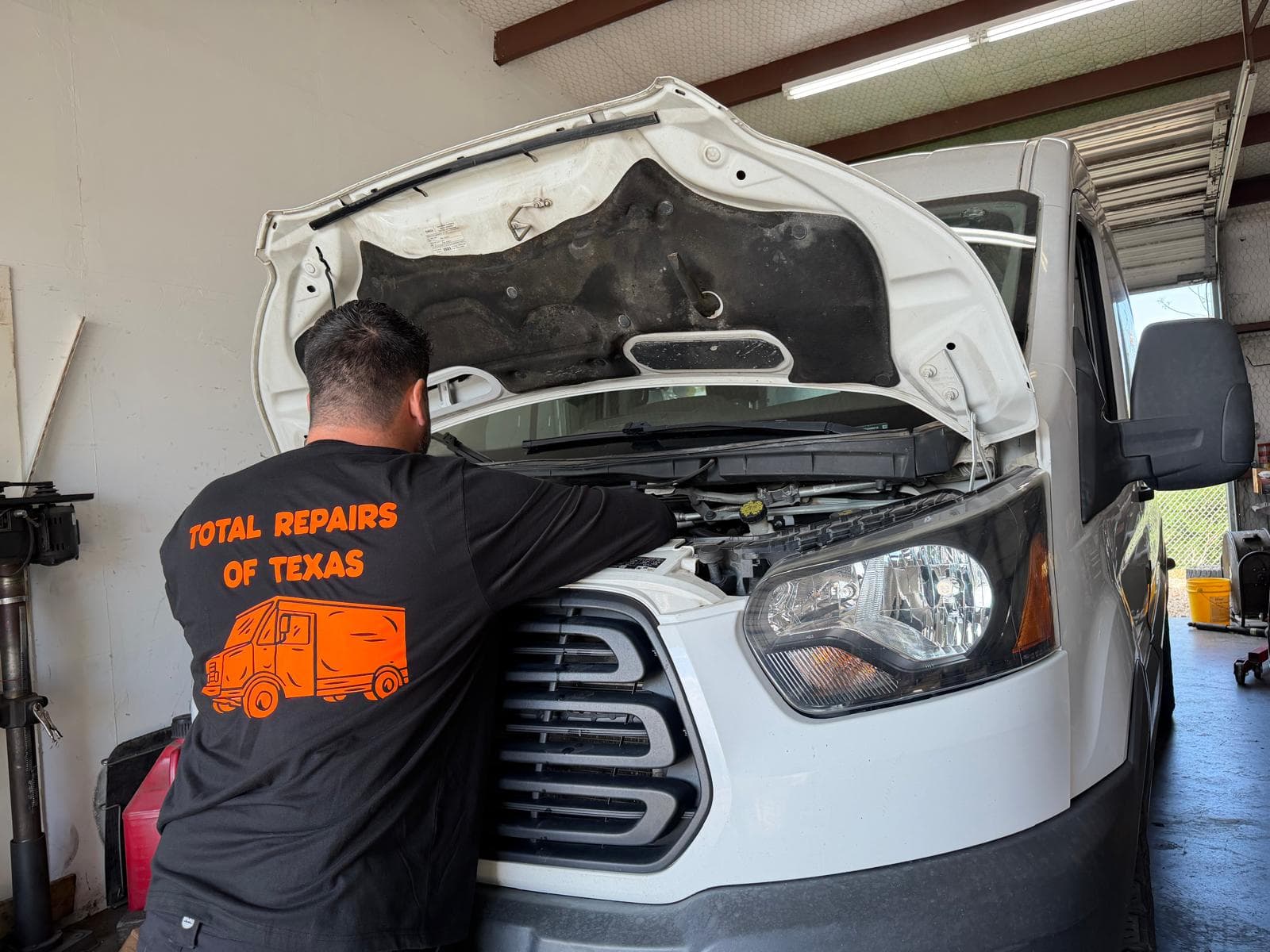 Mechanic repairing diesel truck in Fort Worth